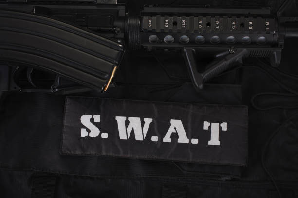 istock Special weapons and tactics team equipment on black uniform 1210934074