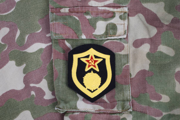 istock Soviet Army chemical troops shoulder patch on camouflage uniform background 1210934084