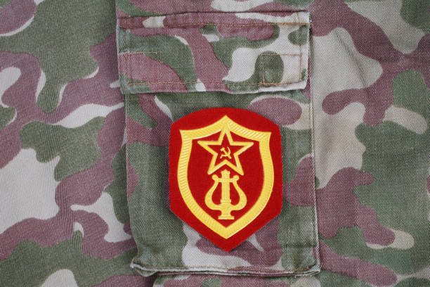 istock Soviet Army Military Orchestra Service shoulder patch on camouflage uniform background 1210934770