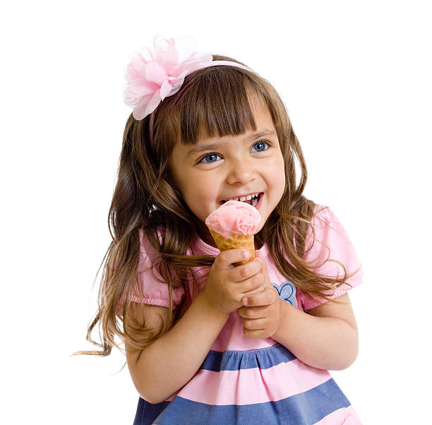 istock A little girl eating an ice cream cone 121093503