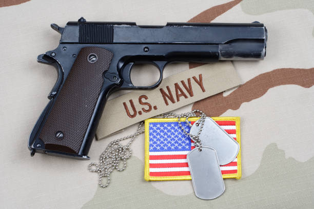 istock Colt government 1911 with U.S. NAVY uniform 1210935503