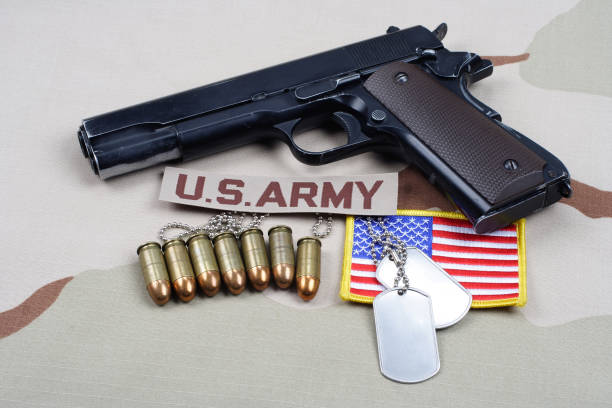 istock Colt government 1911 with U.S. ARMY uniform 1210935540