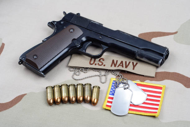 istock Colt government 1911 with U.S. NAVY uniform 1210935559