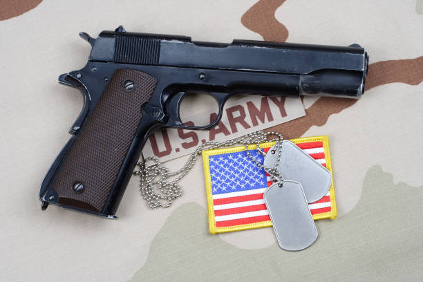 istock Colt government 1911 with U.S. ARMY uniform 1210935653