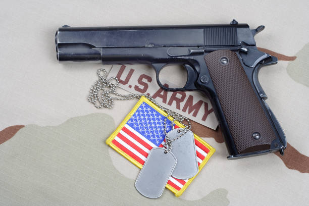 istock Colt government 1911 with U.S. ARMY uniform 1210936108