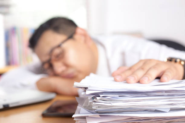 istock Tired Sleepy Asian Businessman Having Overworked 1210936121