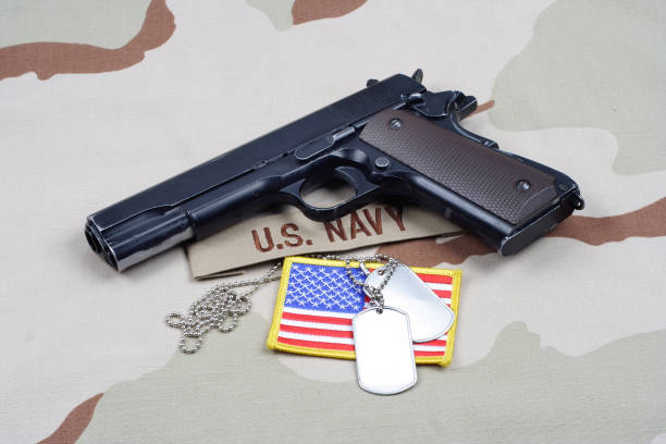 istock Colt government 1911 with U.S. NAVY uniform 1210936143