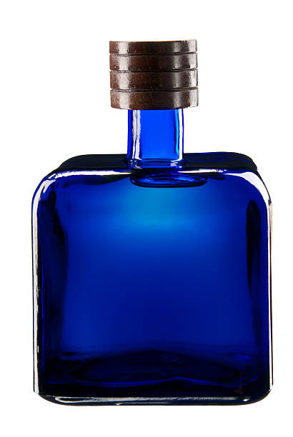 istock Square blue glass bottle full of tequila. 121093650