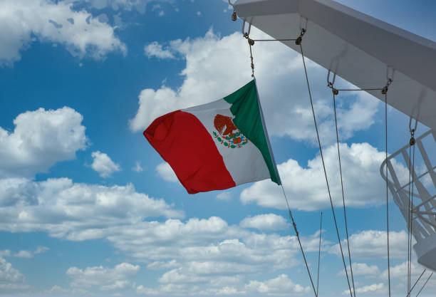istock Mexican Flag Flying on Cruise Ship 1210940555