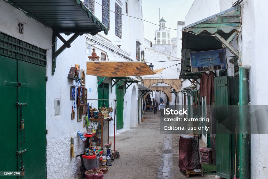 Green wooden doors of the old stores in Tetouan Medina quarter in Northern Morocco. A medina is typically walled, with many narrow and maze-like streets. Tetouan, Morocco - May 24, 2017: Green wooden doors of the old stores in Tetouan Medina quarter in Northern Morocco. A medina is typically walled, with many narrow and maze-like streets. Africa Stock Photo