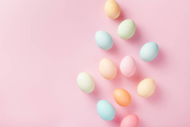 istock Modern template with pastel Easter eggs on pink background top view and flat lay. 1210940927