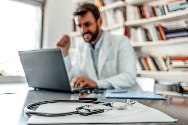 istock Compiling new treatment plans for his patients 1210942128