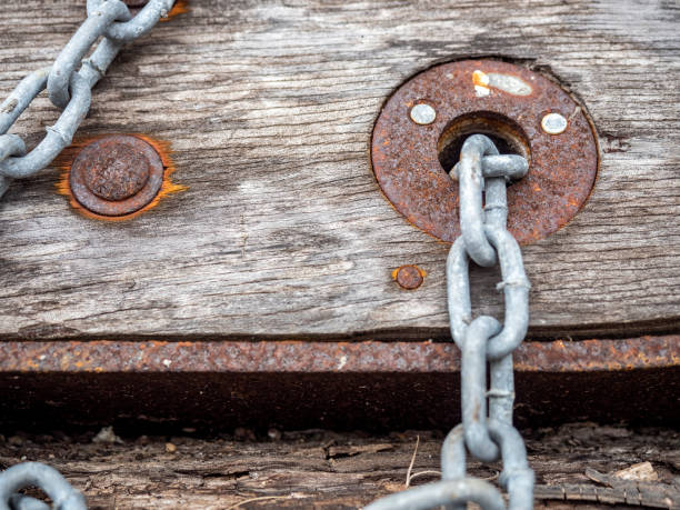 istock Weathered wooden planks with rusty bolts and eyelet 1210946104
