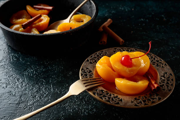 istock Peach dessert with cinnamon and  cherry. 1210947023