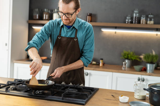 istock Professional Chef Tossing Food 1210947161