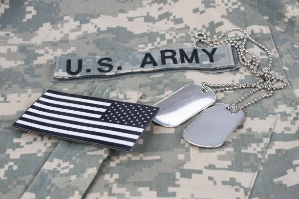 istock US flag patch with dog tag on Army Combat Uniform 1210948501