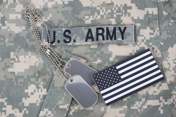 istock US flag patch with dog tag on Army Combat Uniform 1210948527