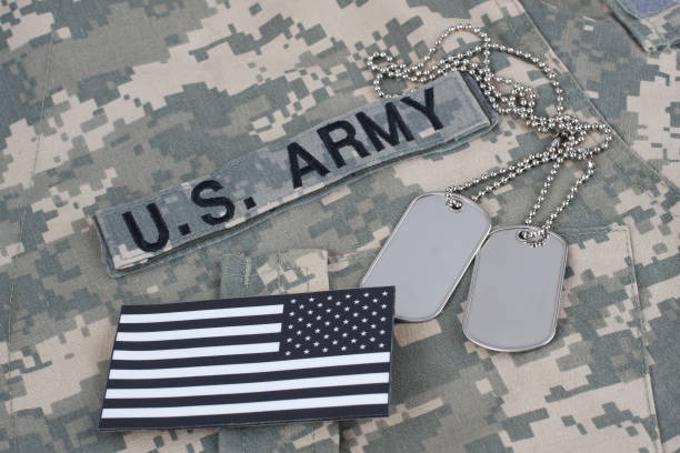 istock US flag patch with dog tag on Army Combat Uniform 1210948537