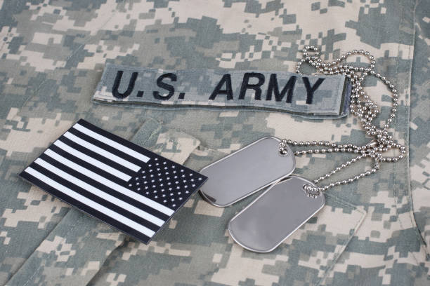 istock US flag patch with dog tag on Army Combat Uniform 1210948597