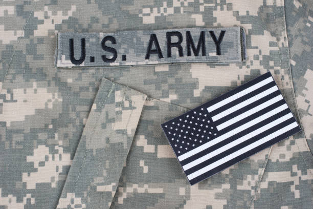 istock US flag patch with dog tag on Army Combat Uniform 1210948653