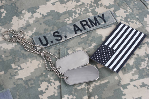 istock US flag patch with dog tag on Army Combat Uniform 1210948718