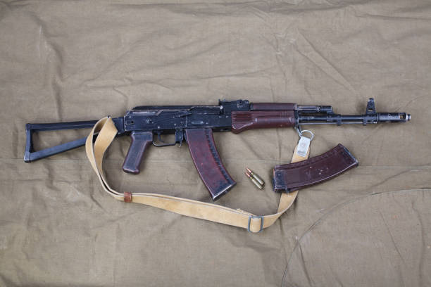 istock Kalashnikov AK 74 with ammunitions on canvas 1210949668
