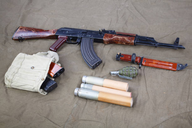 istock Kalashnikov AK 47 with ammunitions on canvas 1210949704
