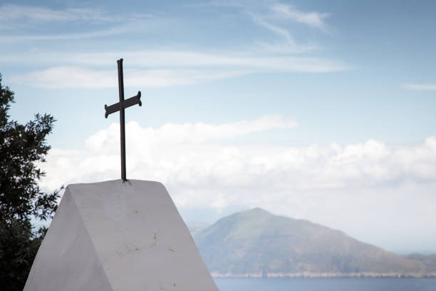 istock religious cross standing ontop of a building 1210950047