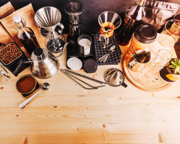 istock Barista's workplace Accessories and utensils for making coffee drinks on a wooden table, coffee shop interior 1210951712