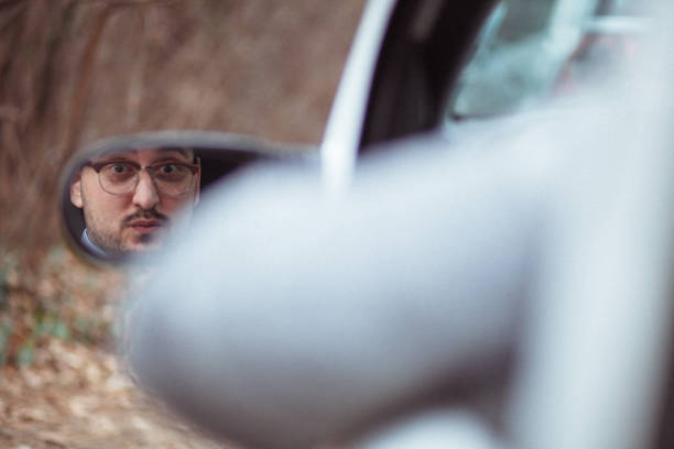 istock Young man in car driving 1210952290