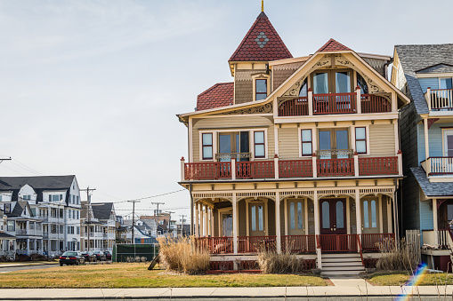 Ocean Grove, NJ / USA - March 5, 2020:  Victorian Homes painted in complimentary colors and ornate details decorated seasonally are found throughout the quaint beach town