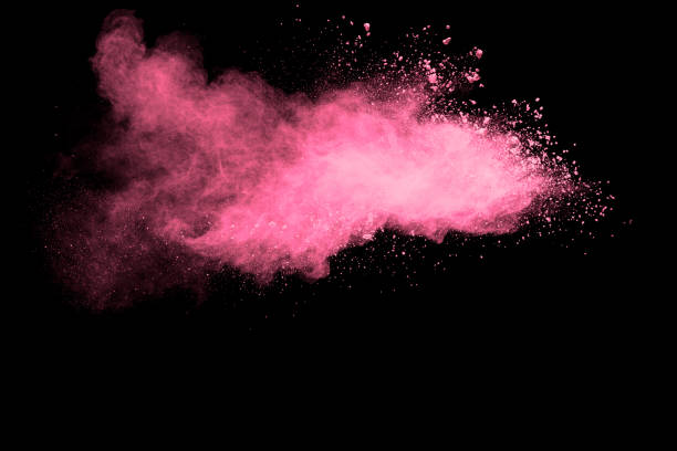 istock Pink powder explosion on black background.Pink dust splash cloud on dark background. 1210953279