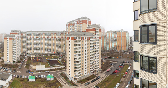 View of residential buildings in city against sky