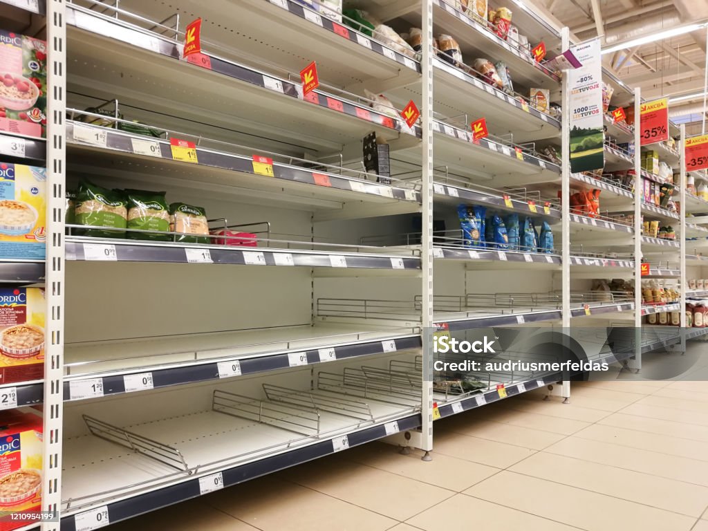KAUNAS, LITHUANIA - FEBRUARY 29, 2020: Empty shelves in a Maxima supermarket. Shortages of goods during panic of Corona virus. KAUNAS, LITHUANIA - FEBRUARY 29, 2020: Empty shelves in a Maxima supermarket. Shortages of products and oats supplies during panic of Corona virus. Supermarket Stock Photo