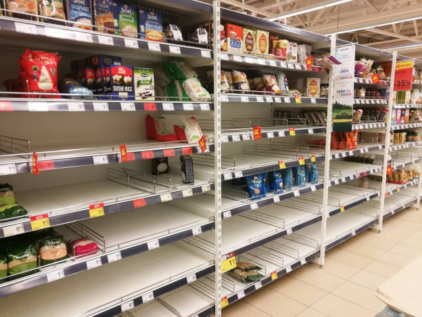 KAUNAS, LITHUANIA - FEBRUARY 29, 2020: Empty shelves in a Maxima supermarket. Shortages of goods during panic of Corona virus. KAUNAS, LITHUANIA - FEBRUARY 29, 2020: Empty shelves in a Maxima supermarket. Shortages of products and oats supplies during panic of Corona virus. sold out photos stock pictures, royalty-free photos & images