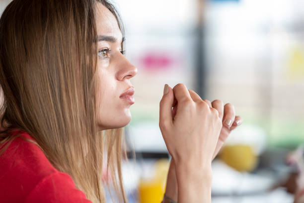 彼女の将来を考えるブロンドの若い女性 - middle eastern ethnicity teenage girls women sadness ストックフォトと画像