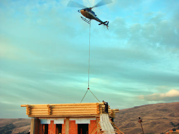 istock Helicopter transports a wood beam 1210955395