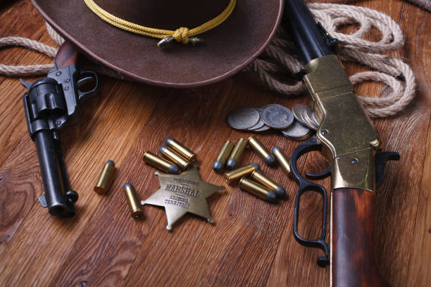 istock Wild west rifle, ammunition and sheriff badge 1210955425