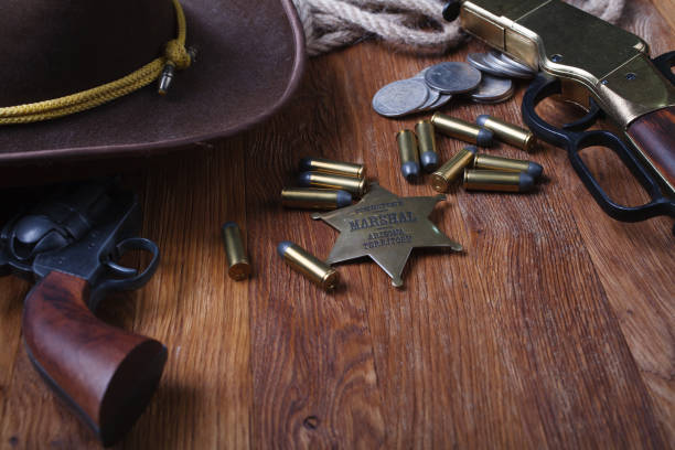 istock Wild west rifle, ammunition and sheriff badge 1210955582