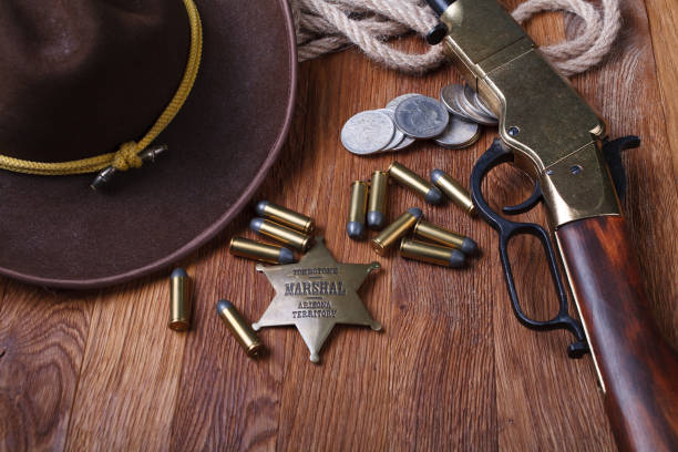 istock Wild west rifle, ammunition and sheriff badge 1210955625