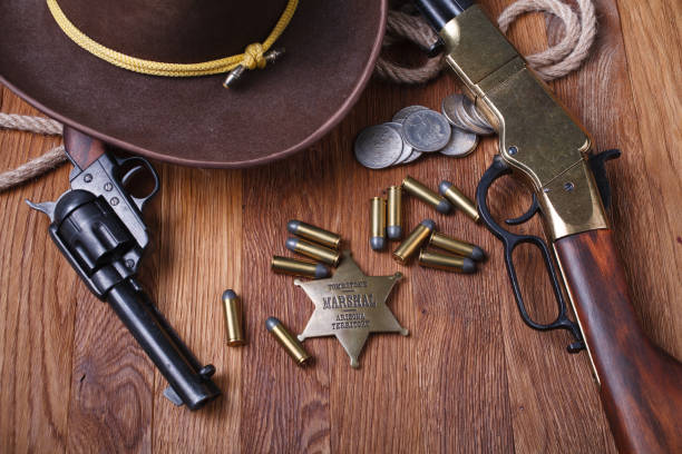 istock Wild west rifle, ammunition and sheriff badge 1210955665