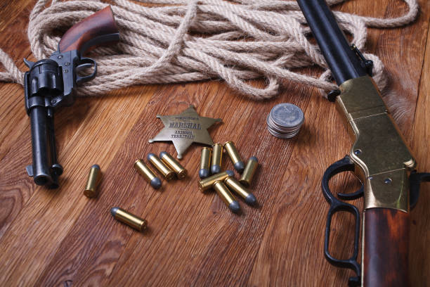 istock Wild west rifle, ammunition and sheriff badge 1210955813