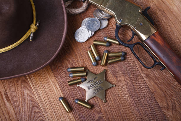 istock Wild west rifle, ammunition and sheriff badge 1210955862
