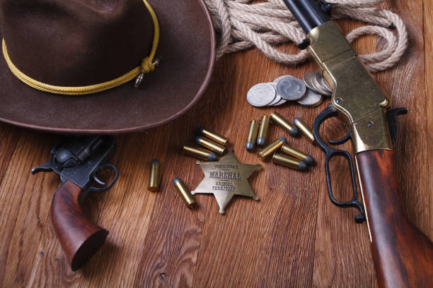 istock Wild west rifle, ammunition and sheriff badge 1210955875