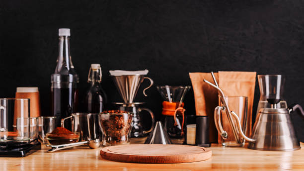 istock Defocused accessories and utensils for making coffee drinks ,wooden tray on foreground 1210956962