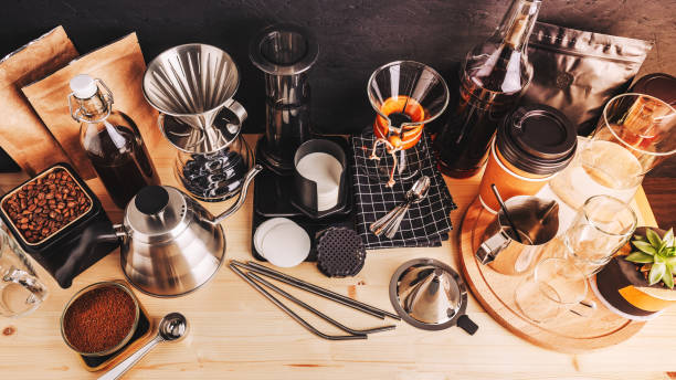 Accessories and utensils for making coffee using alternative methods, wooden table in the interior of the coffee shop
