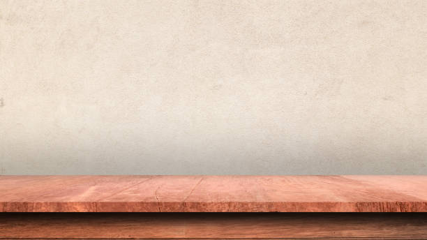 istock Empty top shelves or table wood on concrete wall background. For product mockup. 1210957349
