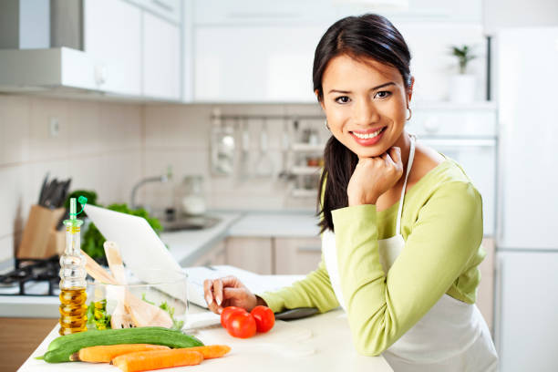 istock Asian woman cooking in the kitchen 1210958218