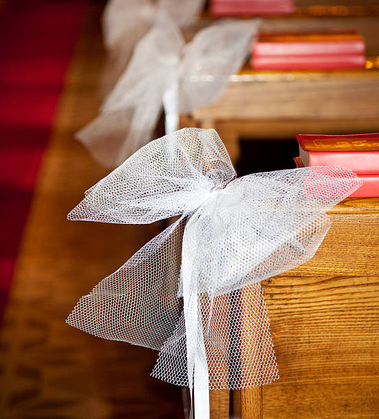 istock White bows in Catholic Church. 121096008