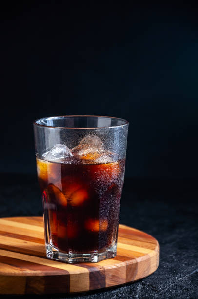 istock Iced Cola or Cold Coffee in Tall Glass on Dark Background. Concept Refreshing Summer Drink 1210960345